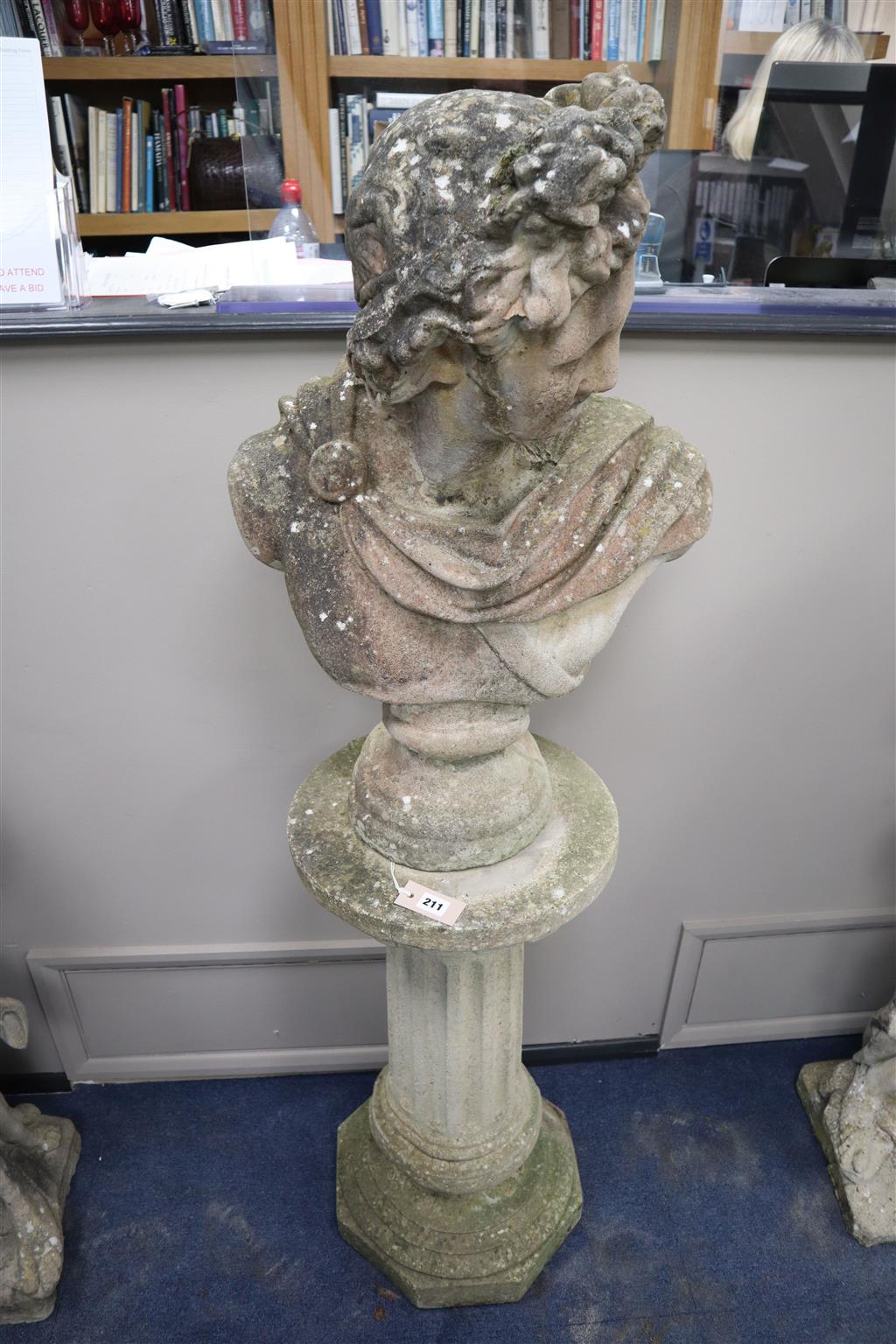A reconstituted stone bust on pedestal, height 162cm